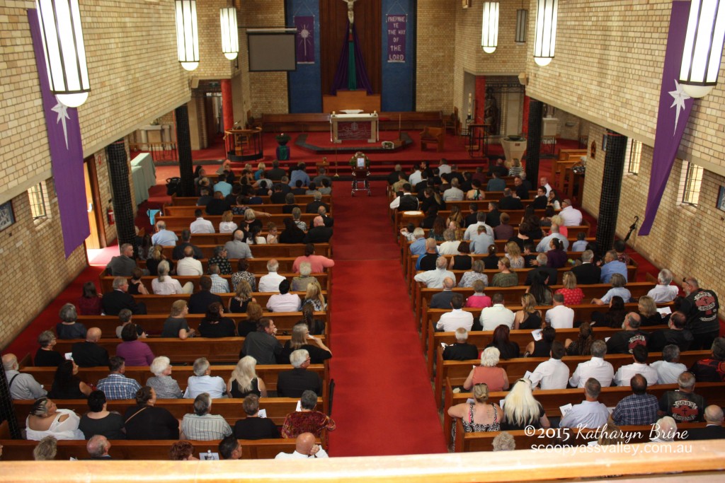 St Augustine's Catholic Church overflowed to the outside area with people celebrating the life of Eric Bell OAM.