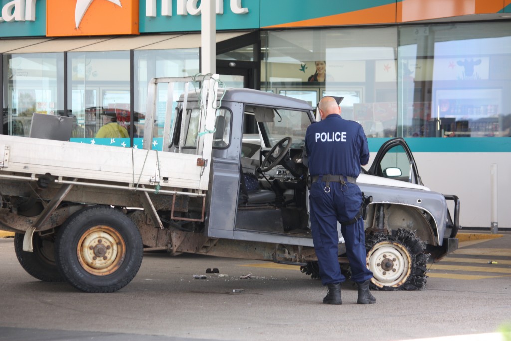 Forensic police investigate the ute involved in a shoot out after a pursuit from Gundagai this morning. PHOTOS: Katharyn Brine