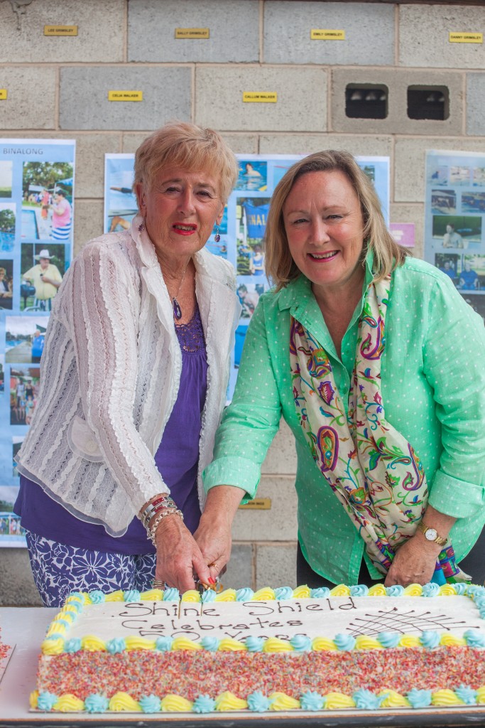 Anne Cooke (Marg Shine's daughter, founder of the Shine Shield) and Mayor Rowena Abbey cut the 50-year anniversary cake.