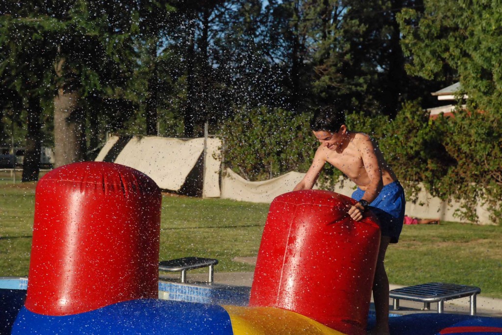 It's all fun until someone gets splashed! The obstacle course proved a hit with families on Saturday.